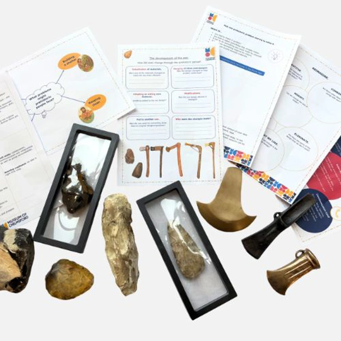 Collection of replica Stone Age items, such as stone tools