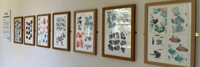 Row of painting hanging on wall