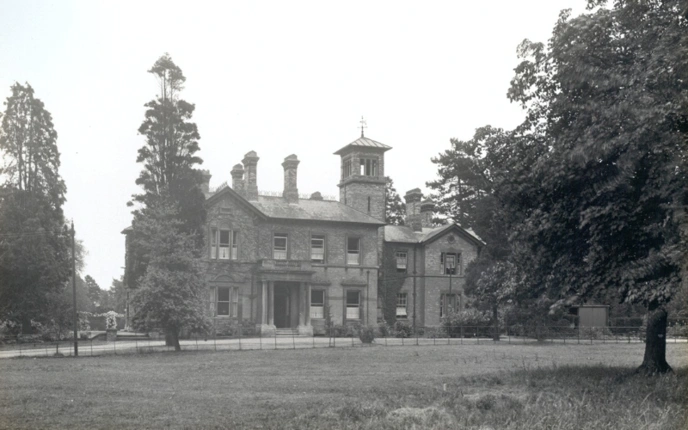 Black and white photo of what is now the museum building
